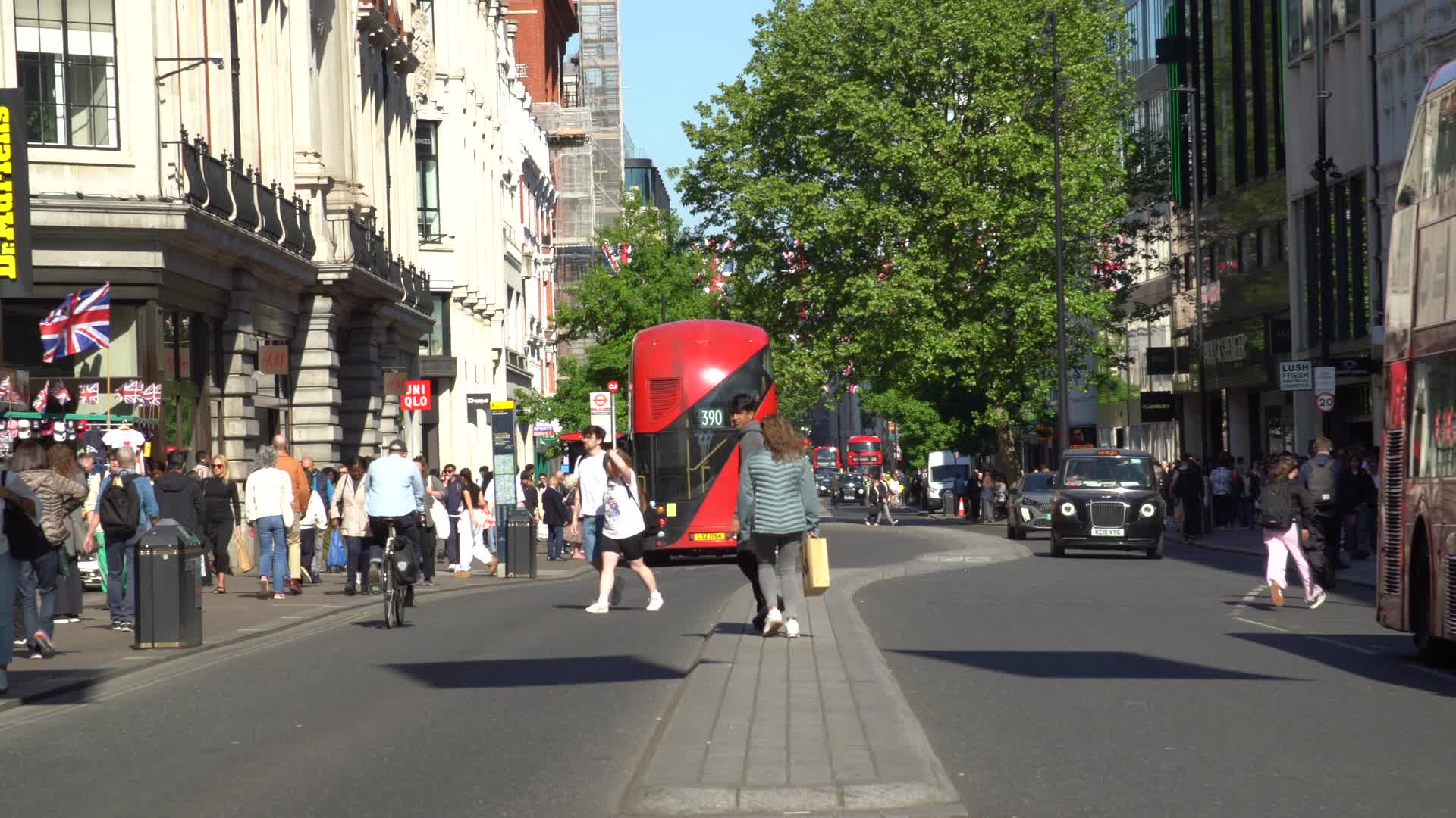 Vibrant Oxford Street Scene with Red Double Decker Buses