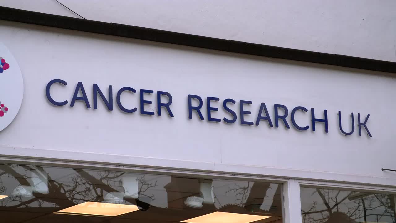 Cancer Research UK Storefront Sign