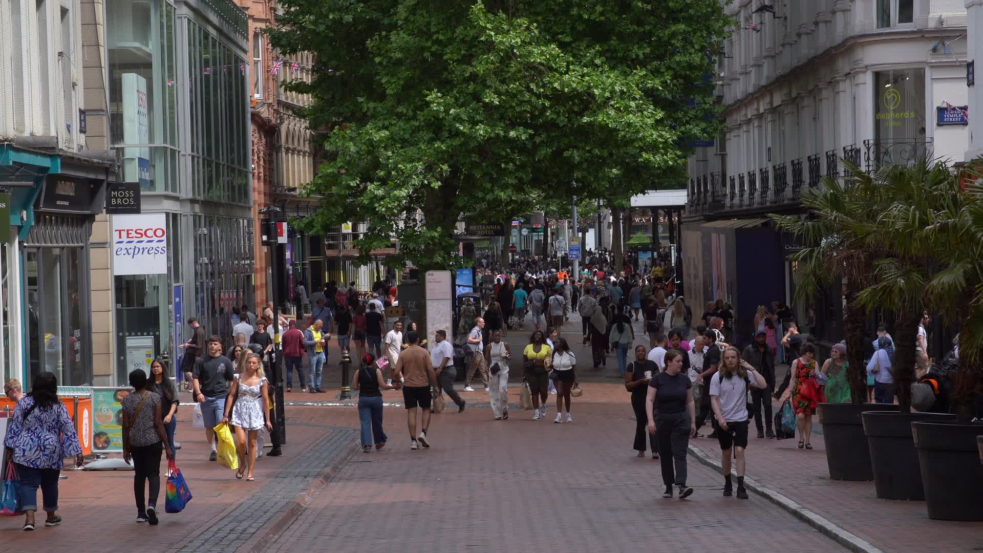 Busy Shopping Scene on New Street in Birmingham, UK