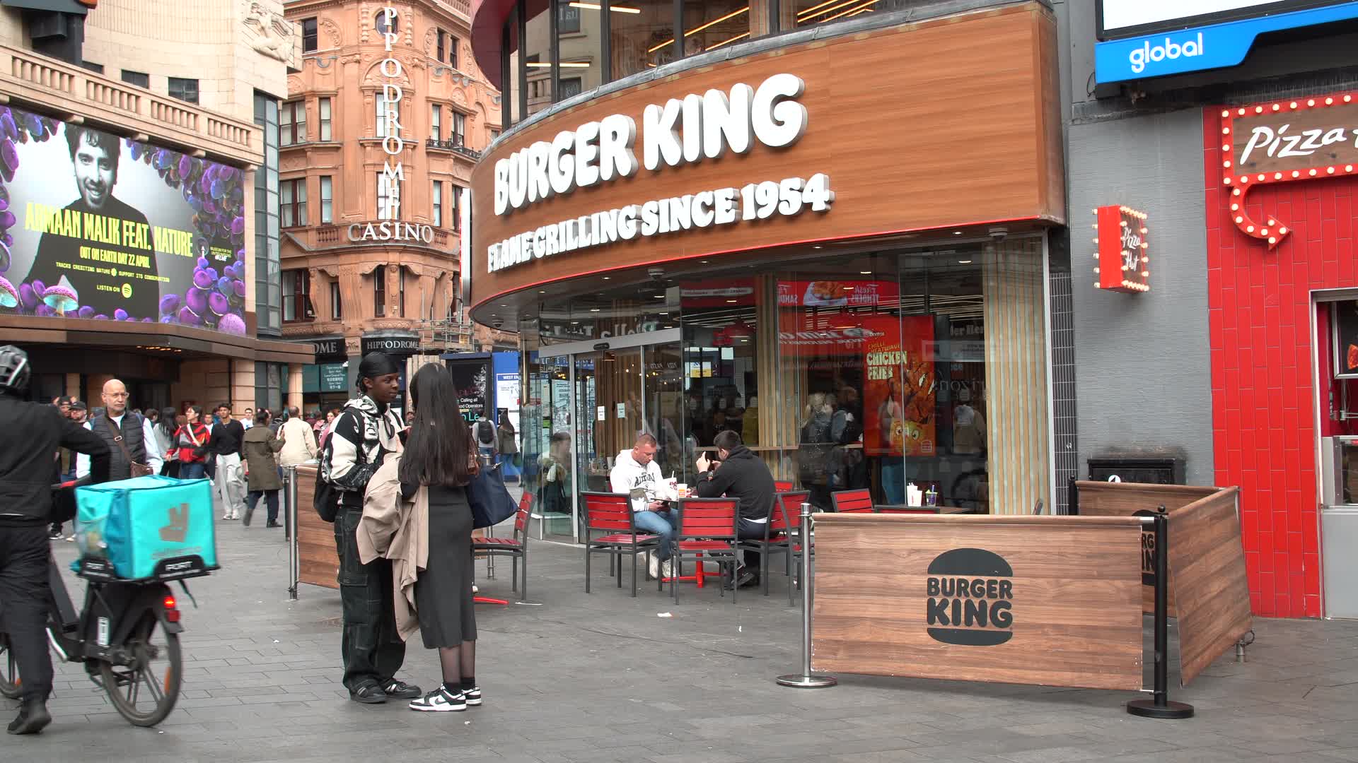 Busy Urban Scene Outside Burger King in London
