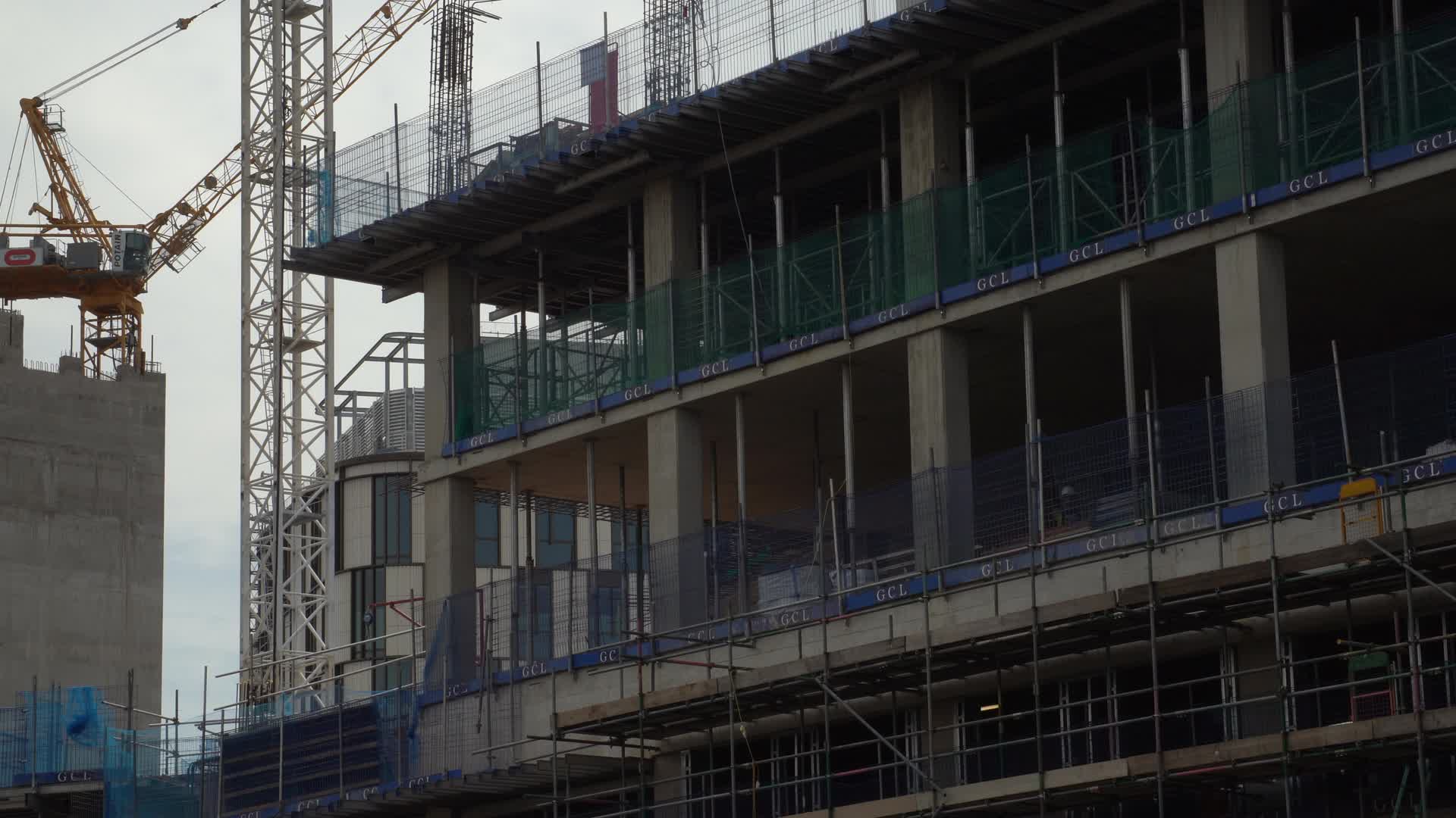 Urban Construction Site Along Canal with Cranes in London