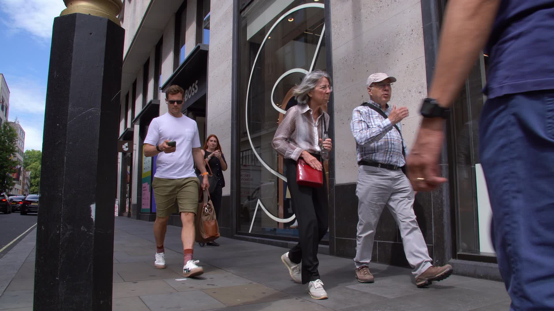 Hugo Boss Storefront on Busy City Street