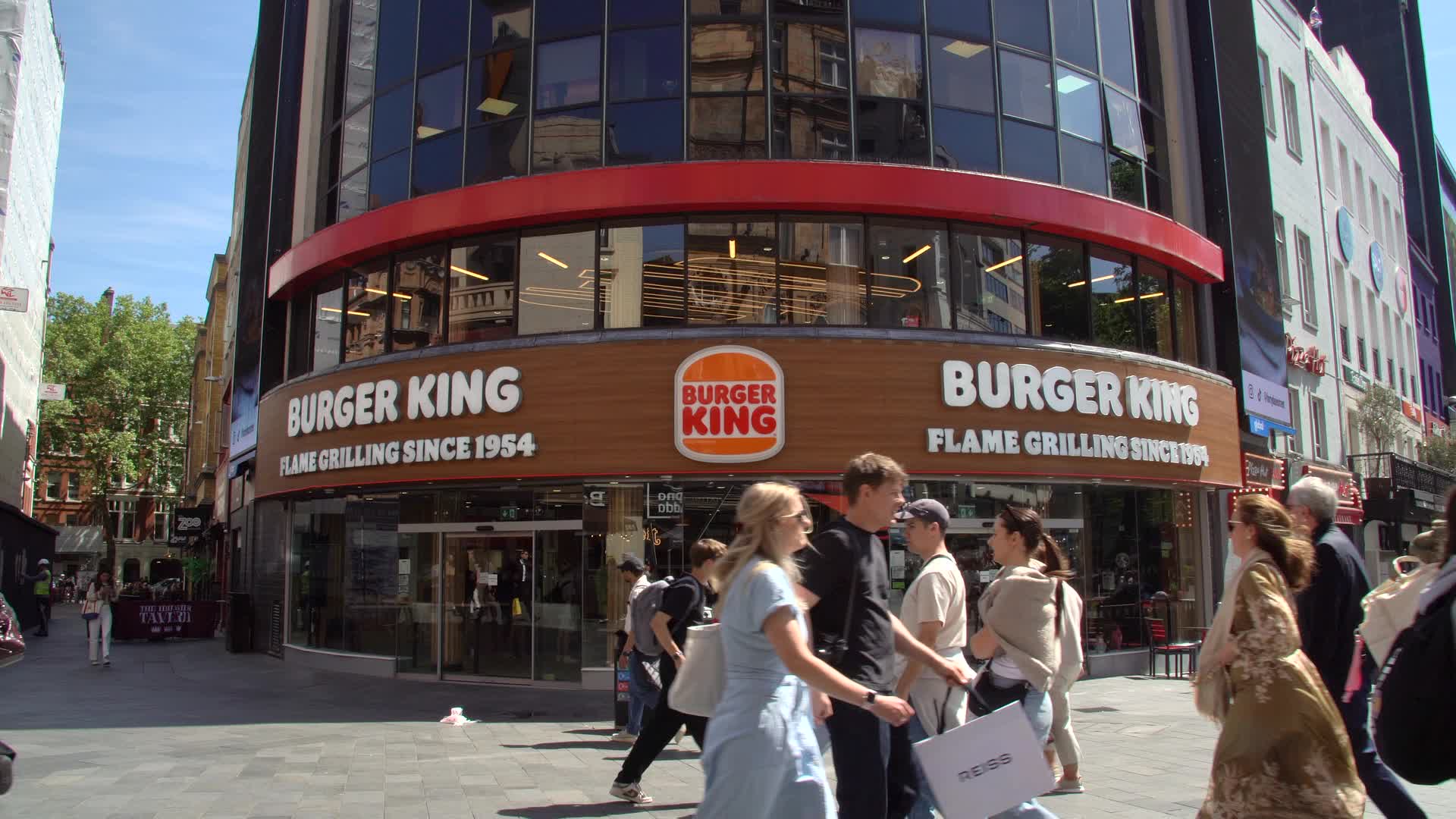 Busy Urban Scene at Burger King Storefront