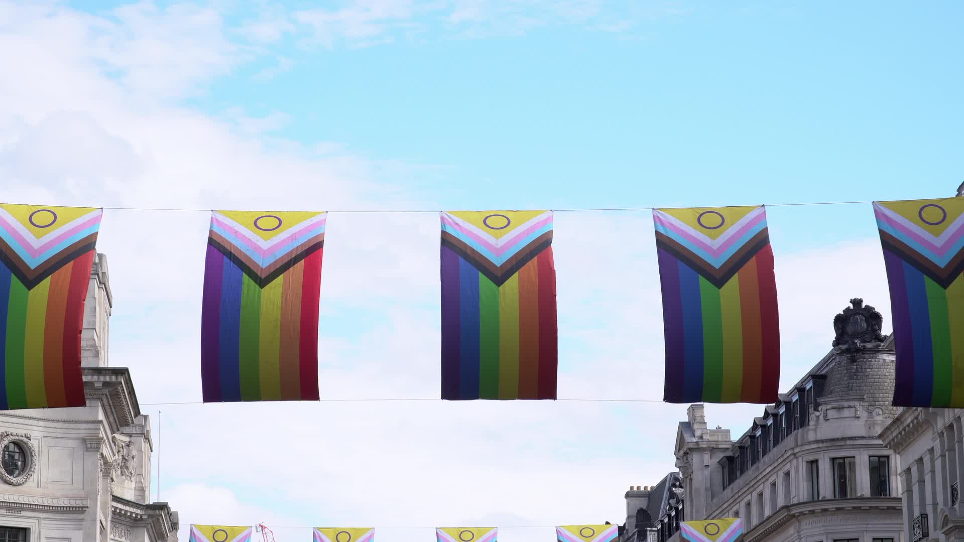 Pride Flags Display Against Blue Sky