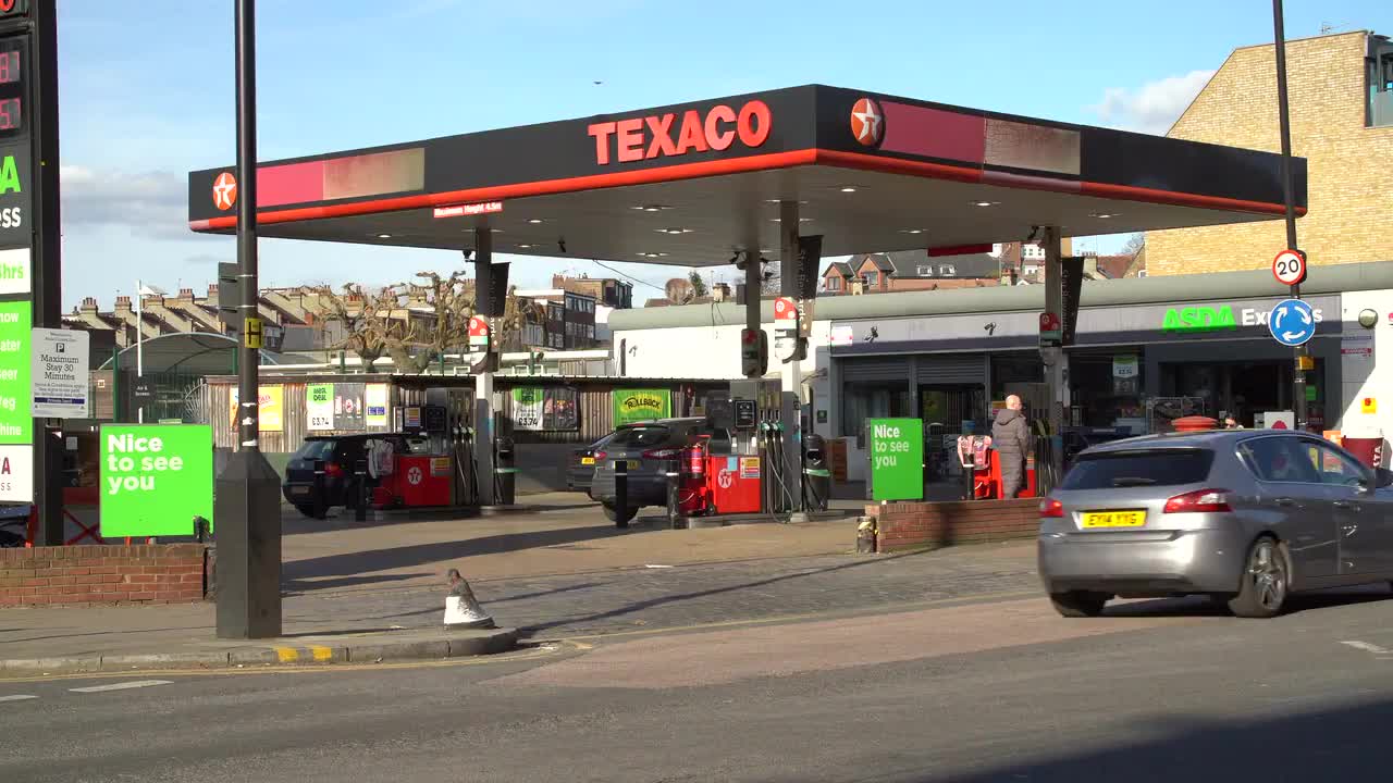 Busy Texaco Gas Station and ASDA Express in Urban Setting