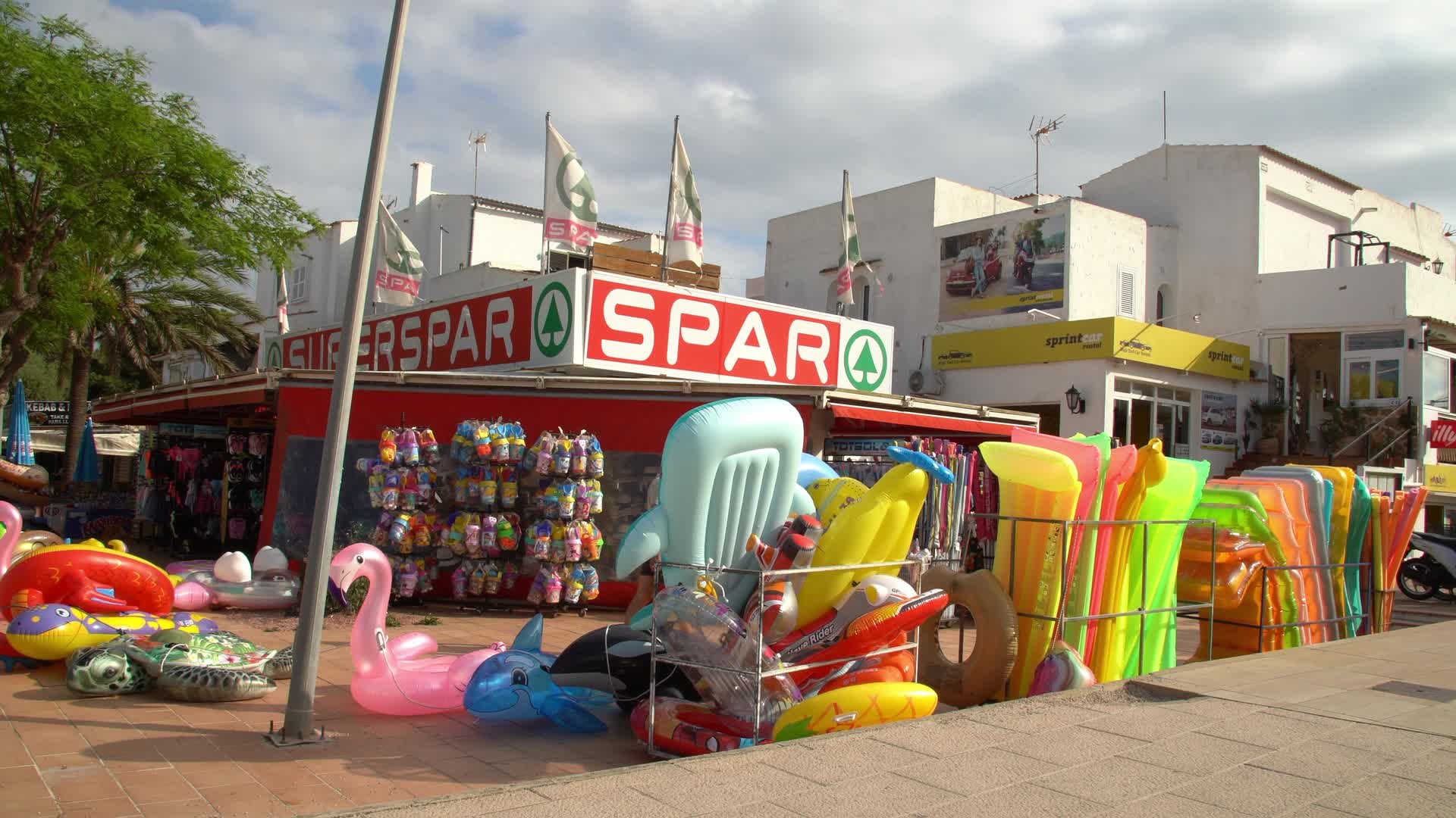Outdoor Display of Inflatable Pool Toys at SPAR Storefront in Cala d'Or, Mallorca, Spain