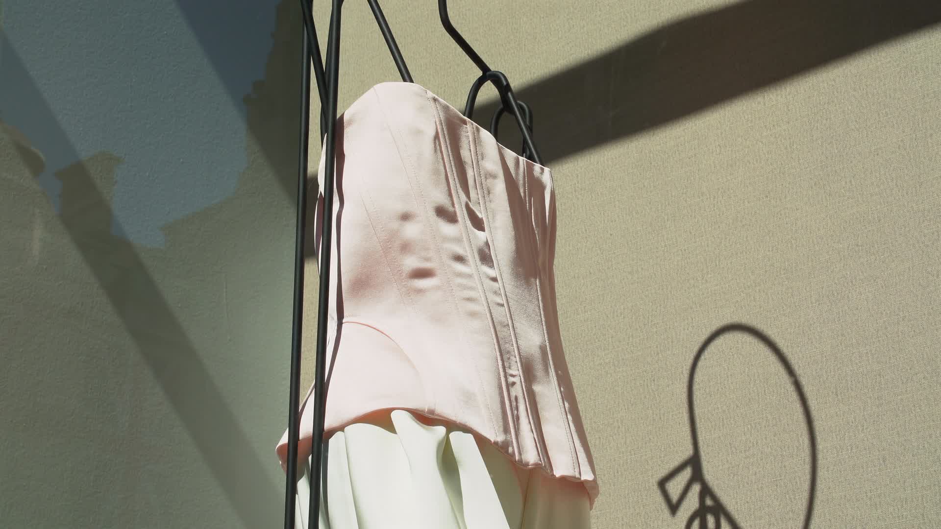 Elegant Fashion Display with Sunlit Shadows