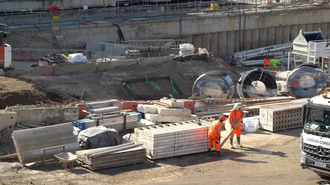 Urban Construction Site with Workers and Machinery