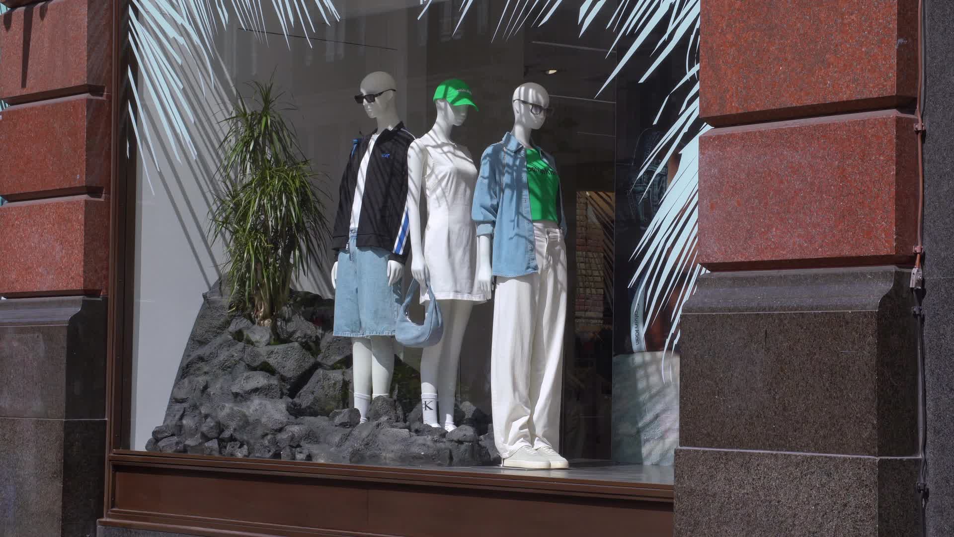 High Street Fashion Display with Mannequins in Summer Outfits
