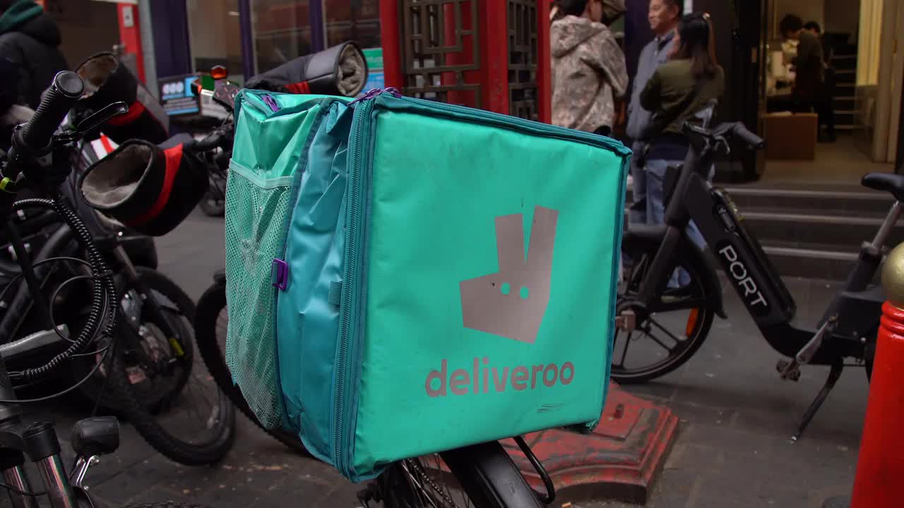 Deliveroo Bike Delivery Scene in Urban Setting