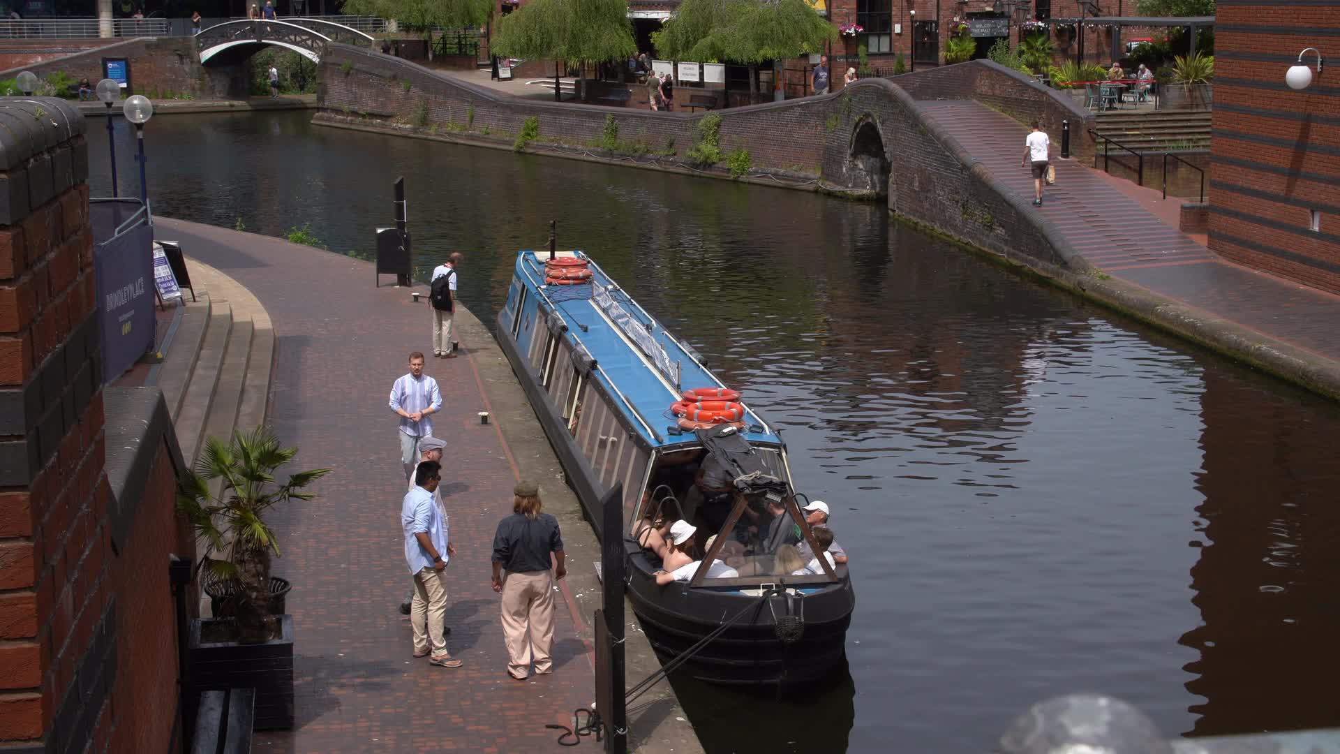 Scenic View of Birmingham Canal with Narrowboat on a Sunny Day