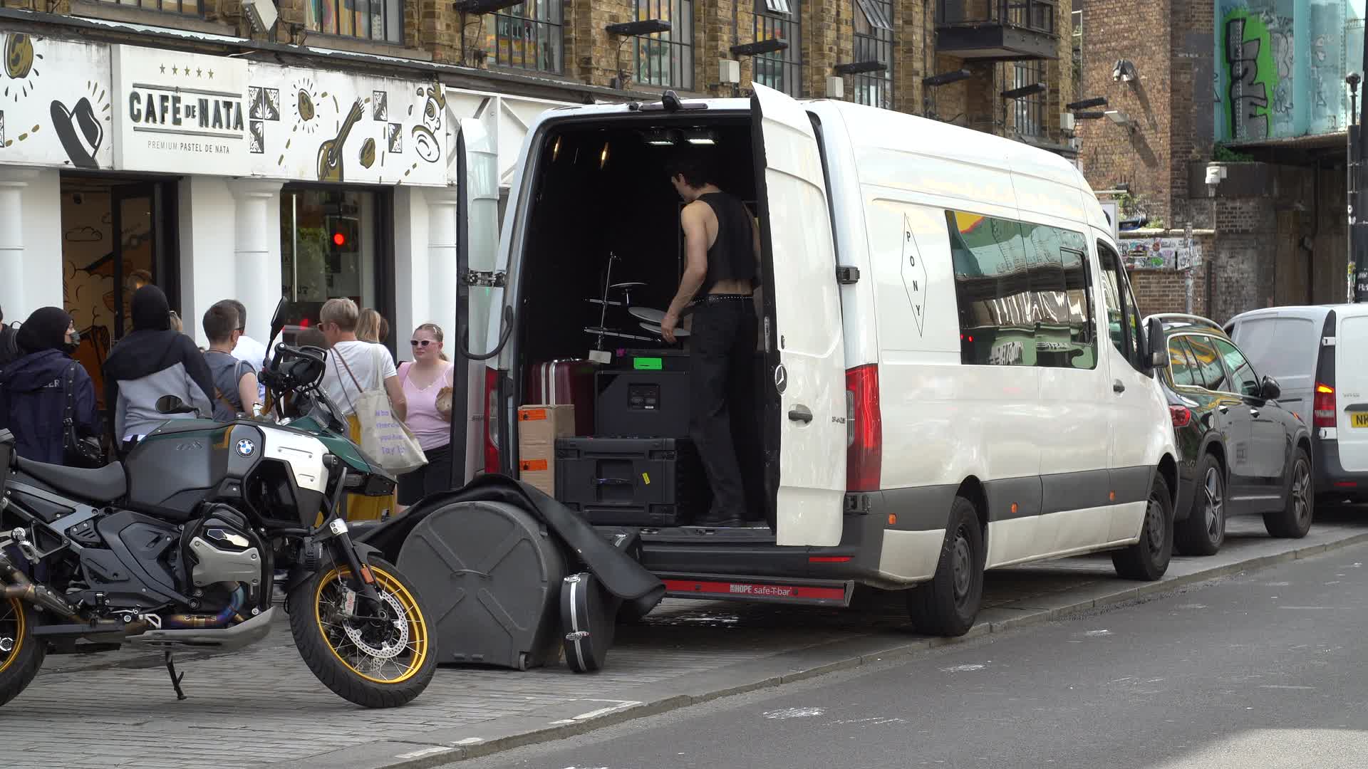 Street Scene with Van and Cafe in Urban Setting