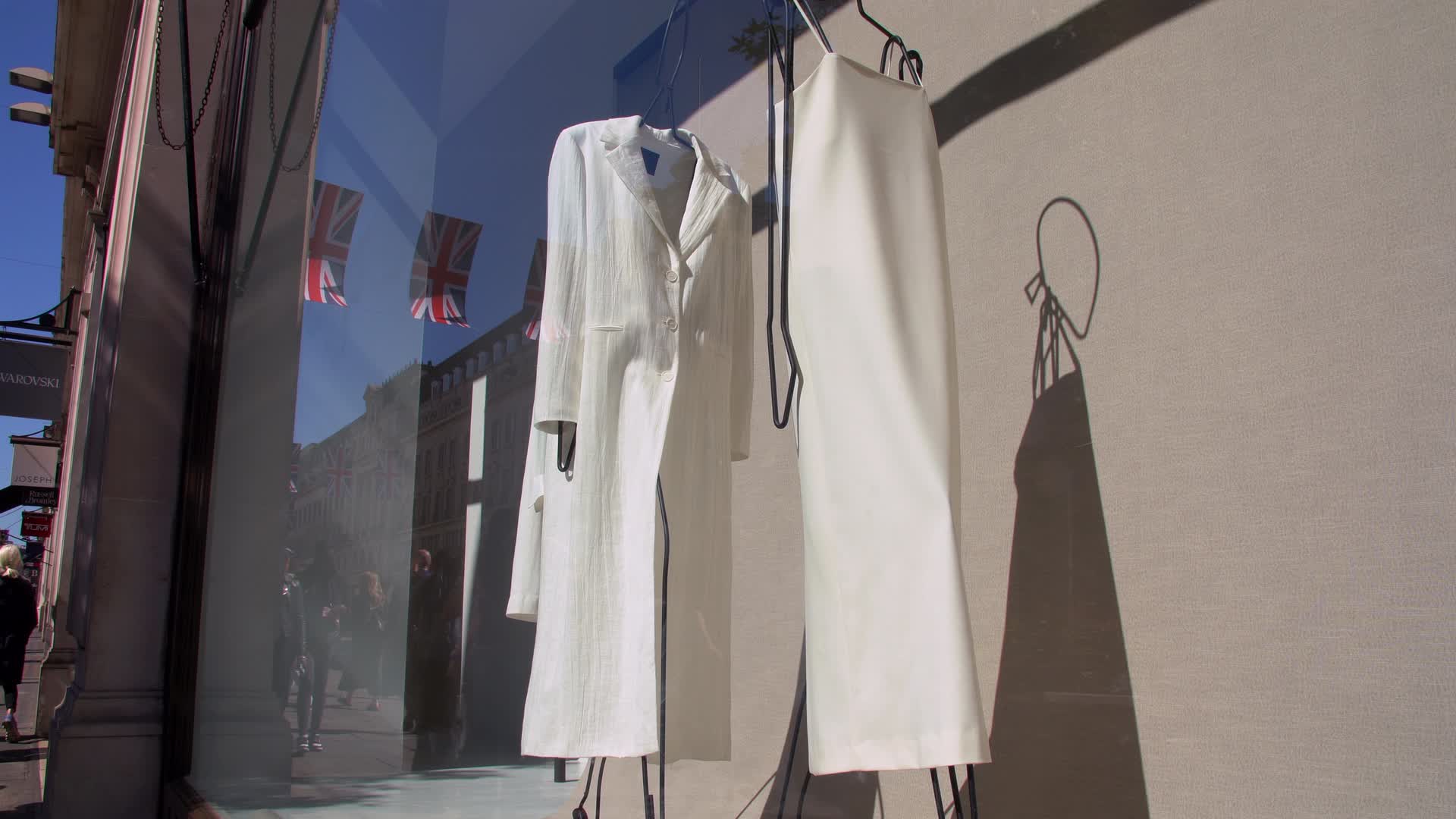 Fashion Storefront Display with Reflections on Shopping Street