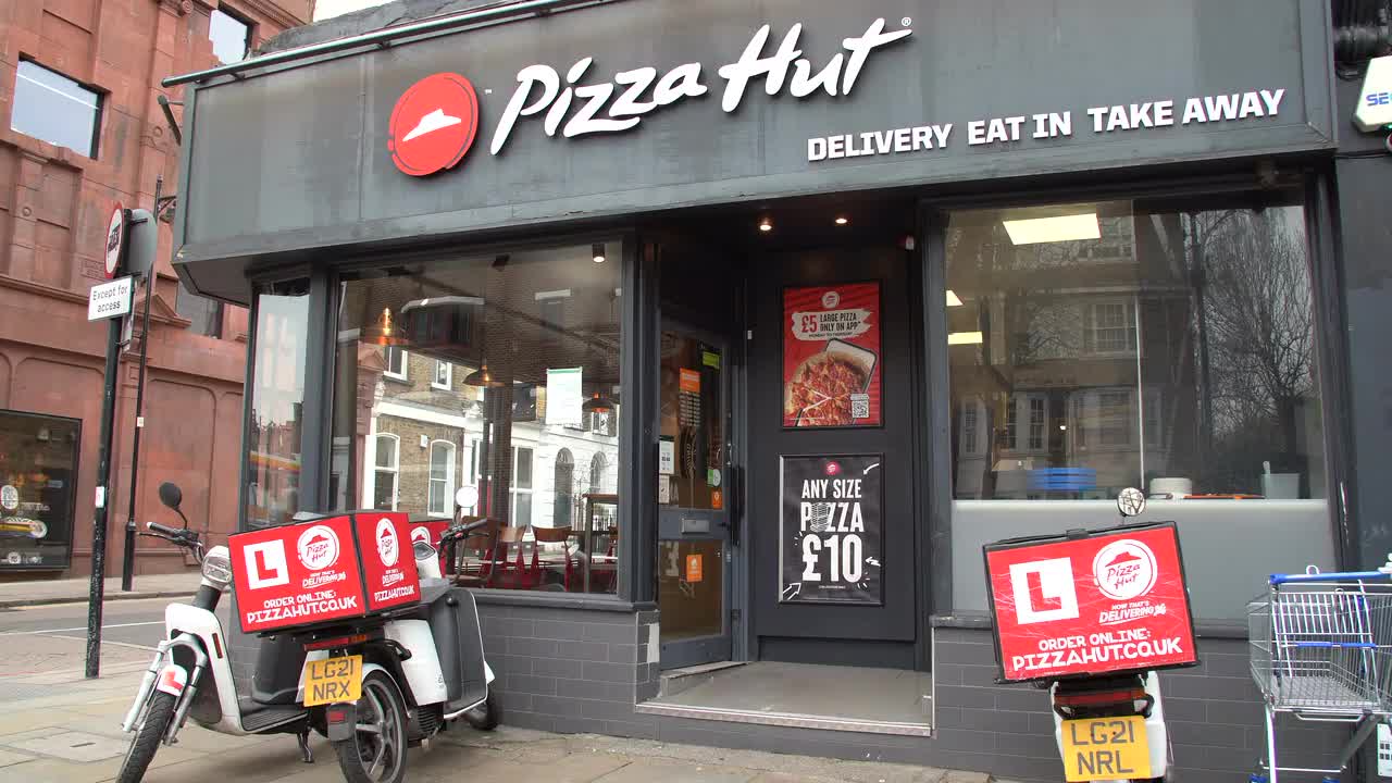 Pizza Hut Storefront and Delivery Scooters