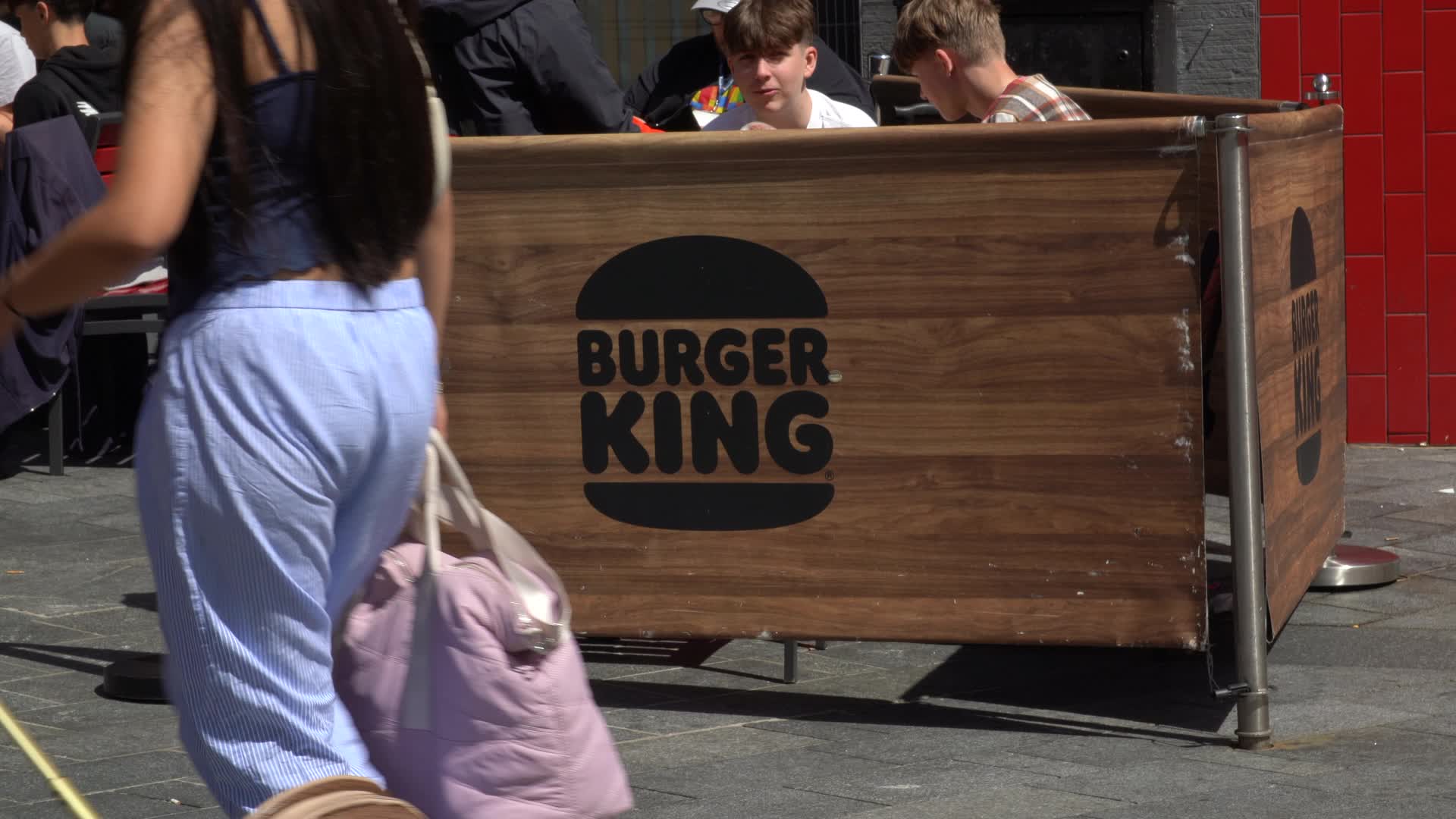 People Enjoying Outdoor Seating at Burger King