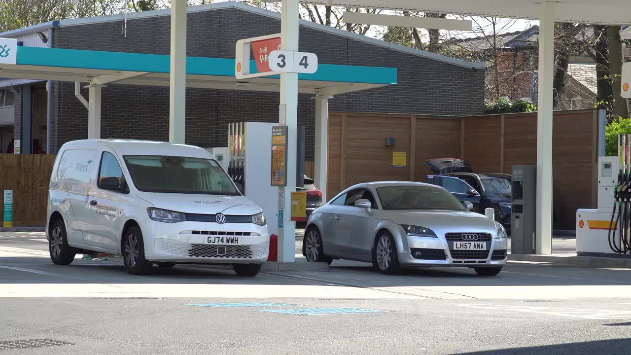 Vehicles Refueling at Shell Gas Station