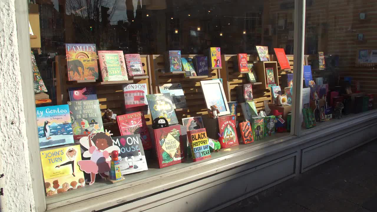 Vibrant Bookstore Window Display in Urban Setting