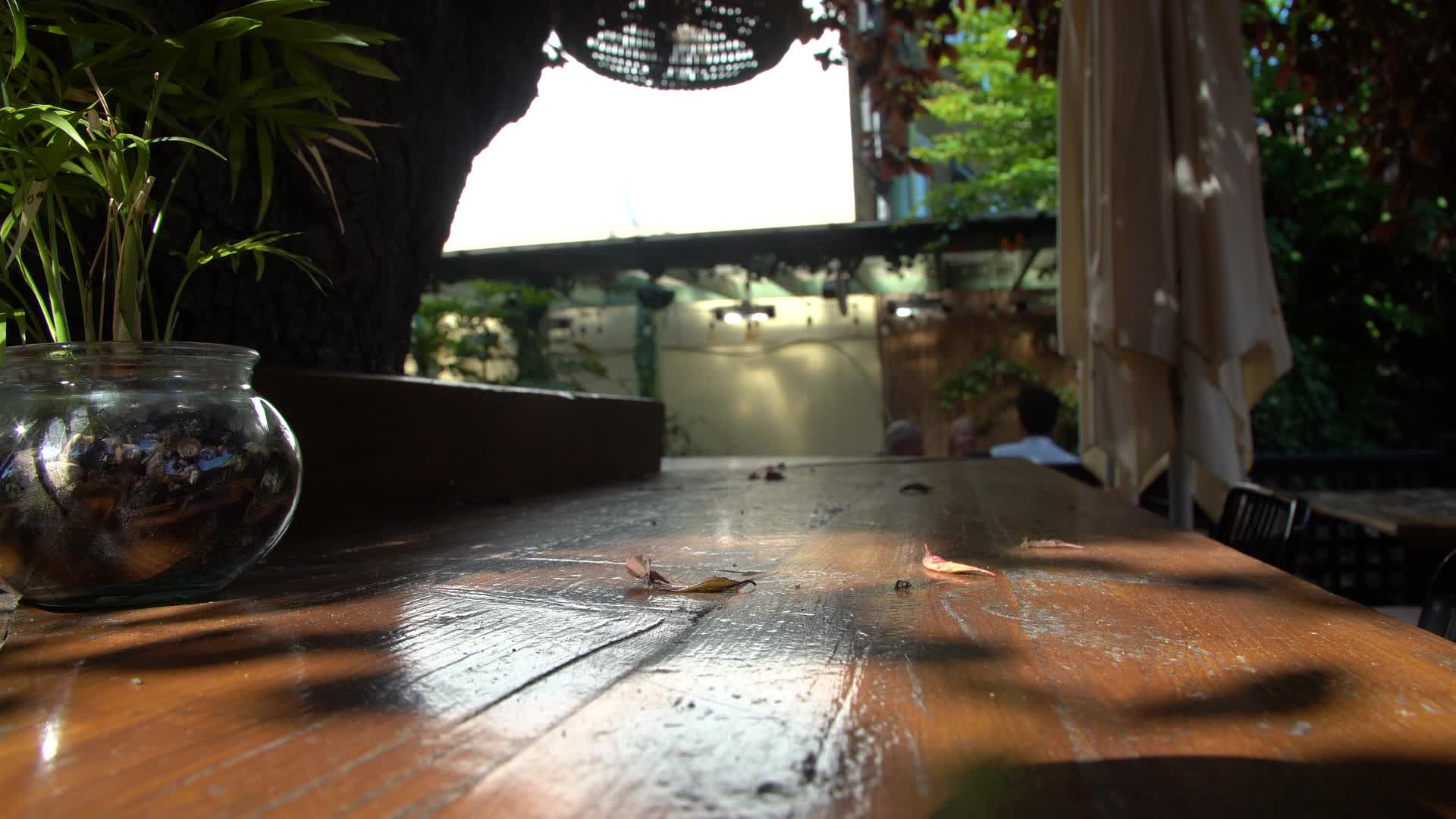 Pint of Beer on Sunlit Outdoor Pub Table in London, UK