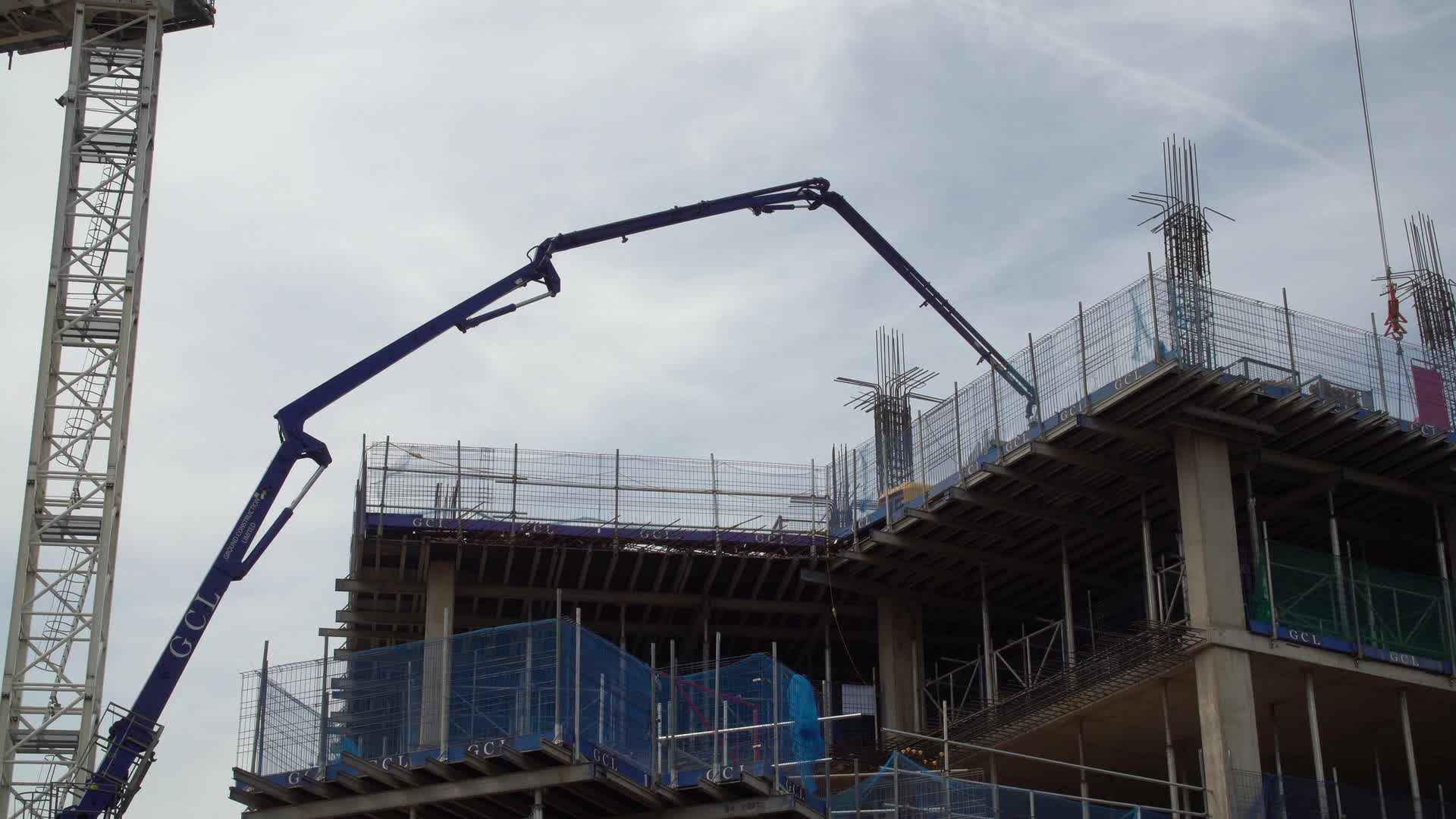 Construction Site with Crane and Concrete Pump in London