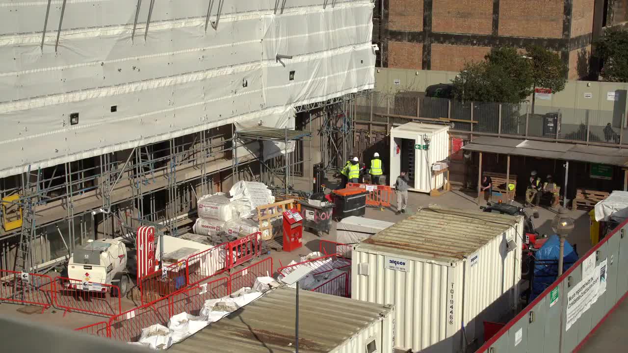 Urban Construction Site with Workers and Equipment