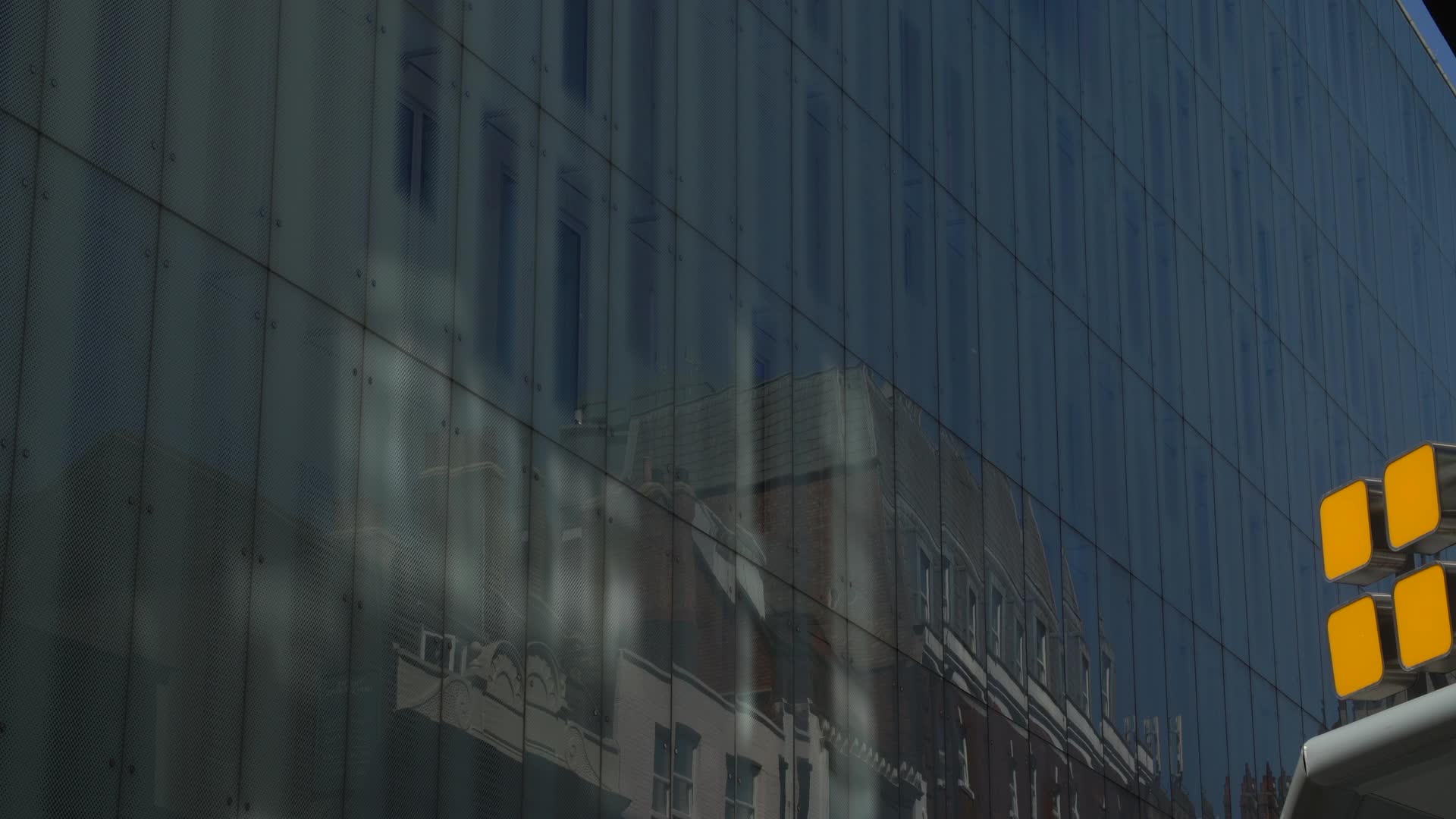 Urban Reflection on Modern Glass Building