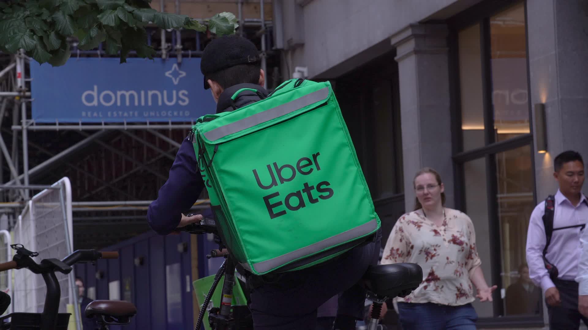 Urban Scene with Uber Eats Delivery Cyclist