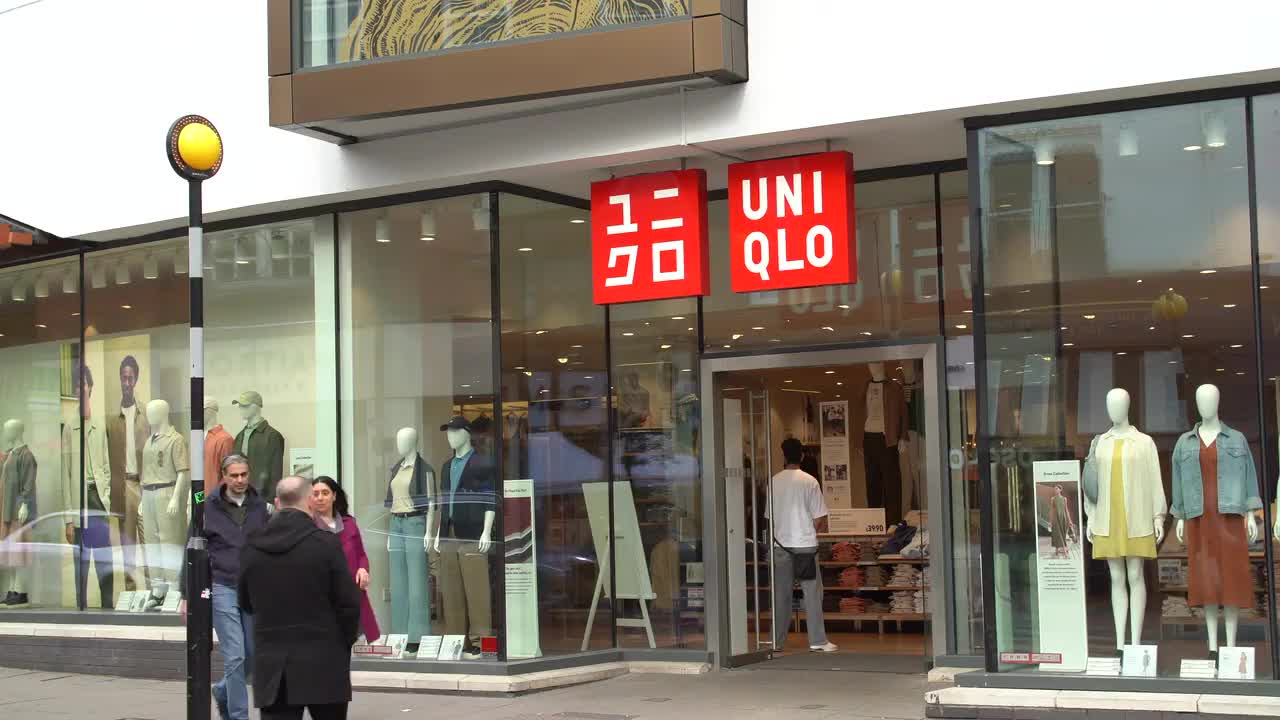 Exterior View of Uniqlo Storefront on Busy Street