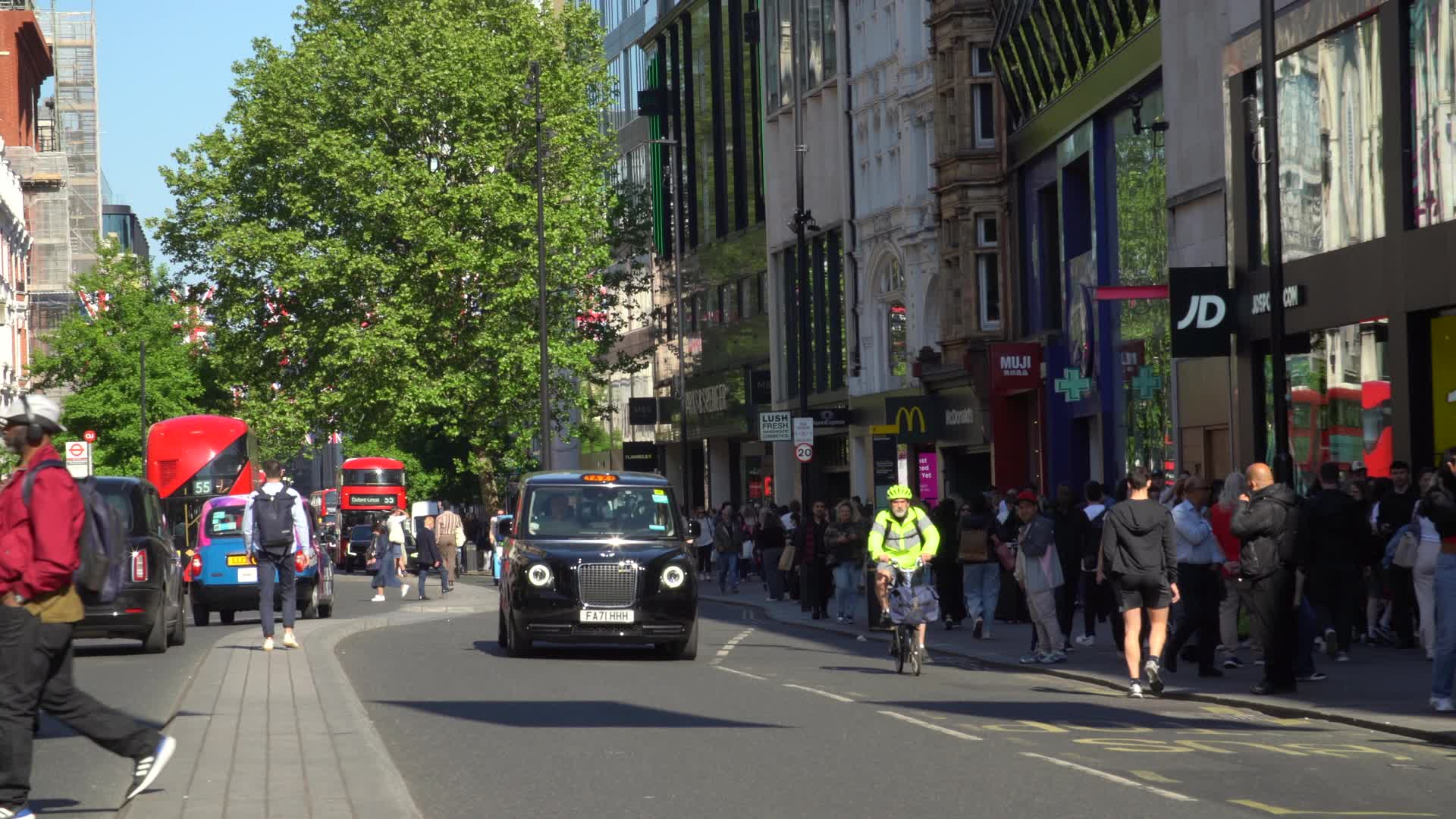 Black Cabs and Busy Streets on Oxford Street, London