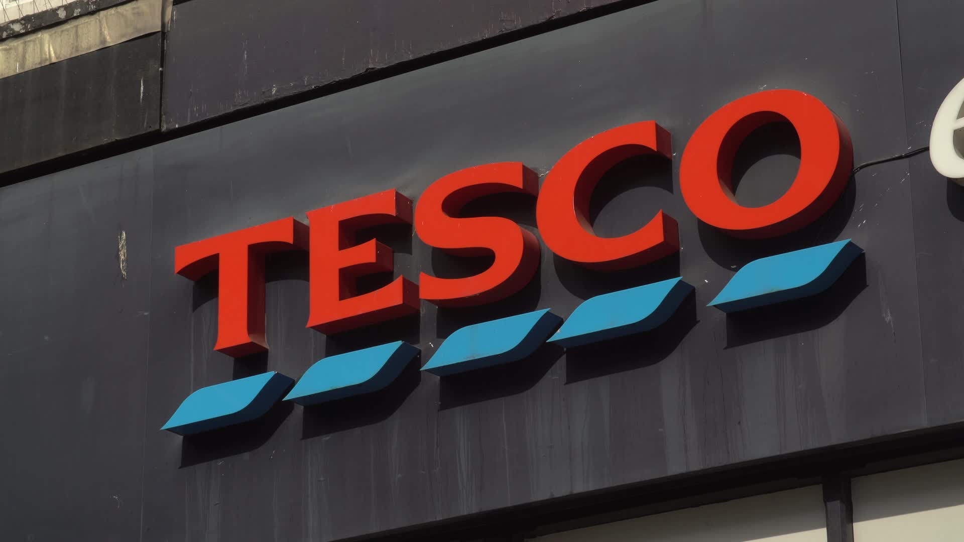 Close-Up of Tesco Storefront Sign in London, UK
