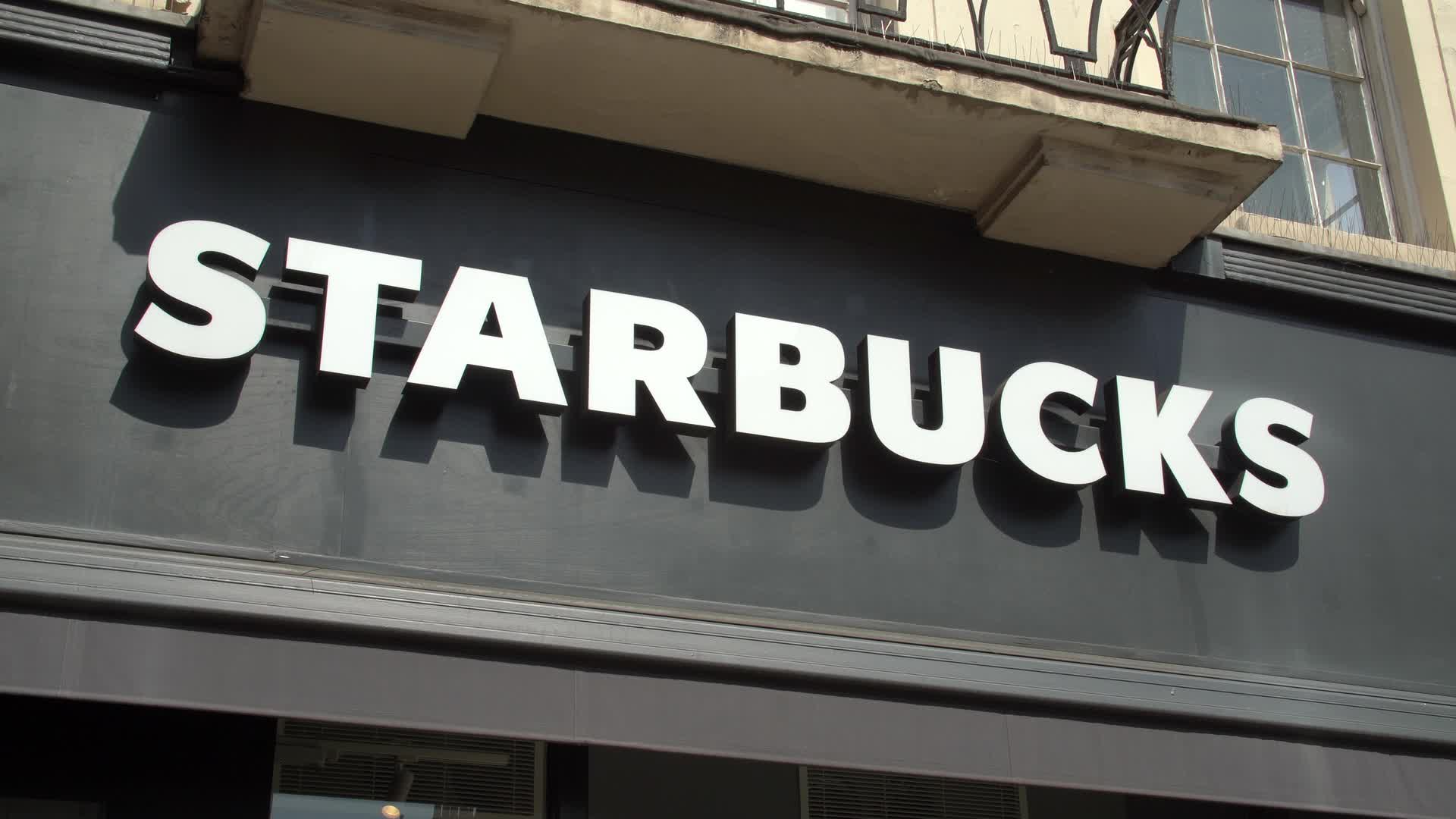 Close-Up of a Starbucks Sign on a Sunny Day in London
