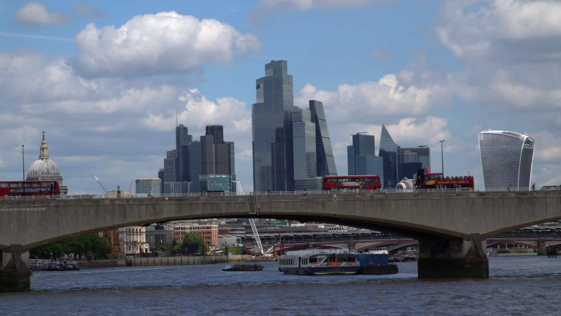 Thames River Cityscape with London Buses and Skyline