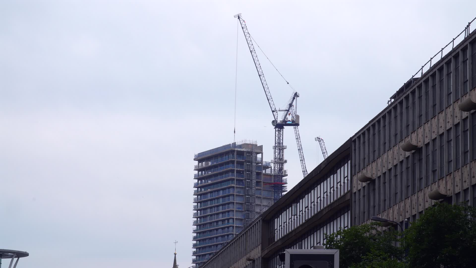 Urban Construction Site with High Crane in Birmingham, UK