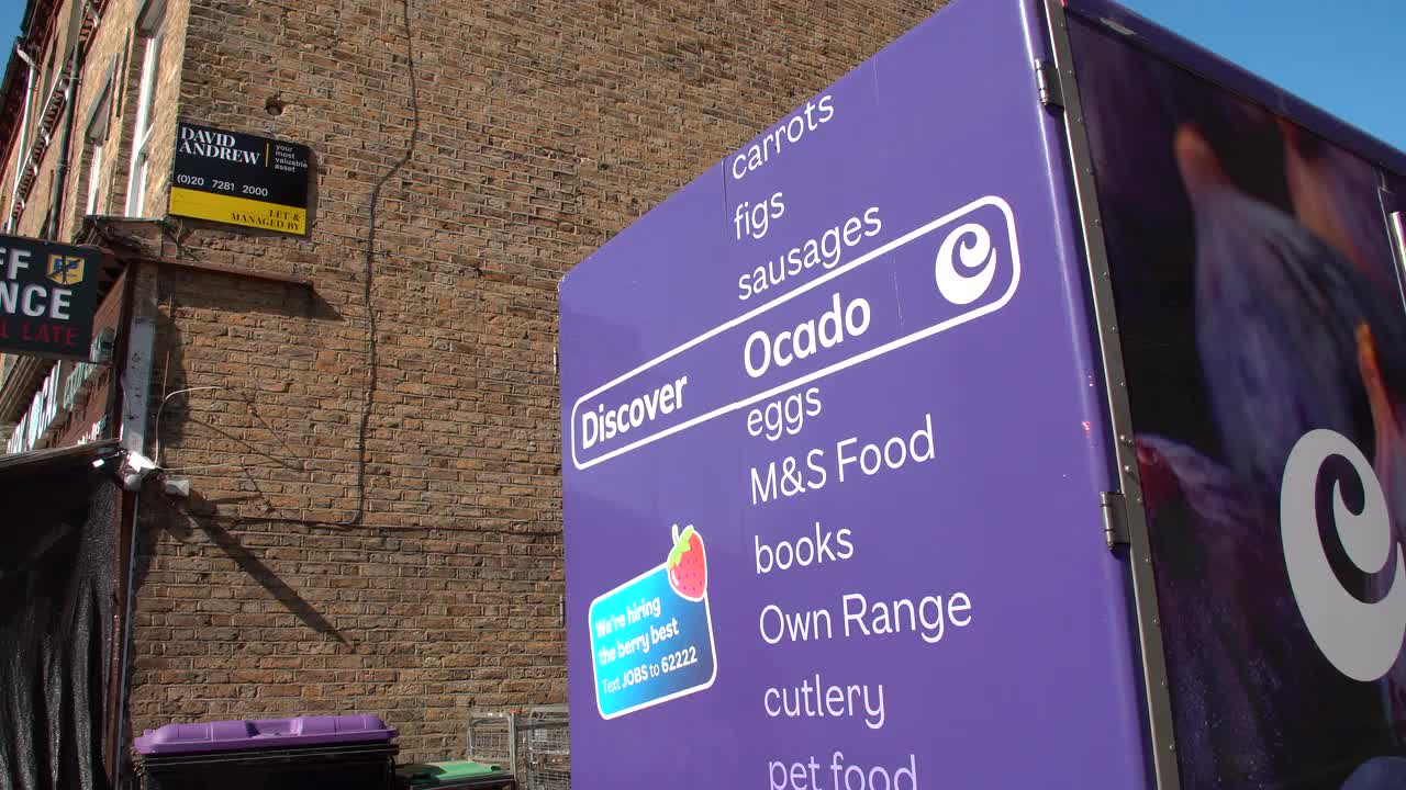 Ocado Delivery Sign with Brick Wall Background